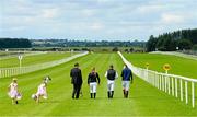 30 August 2015; Jockey coach Warren O'Connor walks the course with jockeys, from right, Robbie Dolan, Conor McGovern and Ellen Hennessy before the day's races as his daughters Annie Mai, age 5, left, and Freya, age 7, follow along. Curragh Racecourse, Curragh, Co. Kildare. Picture credit: Cody Glenn / SPORTSFILE