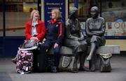 27 February 2009; England supporters Stephanie Cameron, Legal Assistant with the Rugby Football Union, left, and Sandie Le Good, Council Services Executive with the Rugby Football Union, from London, take the weight off on the way to their hotel, ahead of their side's RBS Six nations Championship game against Ireland on Saturday. Temple Bar, Dublin. Picture credit: Brian Lawless / SPORTSFILE