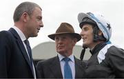 30 August 2015; Jockey Fran Berry talks with his father and racing manager Frank Berry, centre, and Mark Wallace, trainer representative, after winning the Tote Irish Cambridgeshire on Hint Of A Tint. Curragh Racecourse, Curragh, Co. Kildare. Picture credit: Cody Glenn / SPORTSFILE