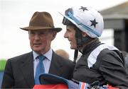 30 August 2015; Jockey Fran Berry talks with his father/ race manager Frank Berry in the parade ring after winning the Tote Irish Cambridgeshire on Hint Of A Tint. Curragh Racecourse, Curragh, Co. Kildare. Picture credit: Cody Glenn / SPORTSFILE