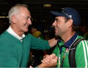 30 August 2015: Charlie Sothern, left, father of Alan Sothern, greets Ireland coach Craig Fulton at Dublin Airport. The Irish Hockey team arrived home into Dublin Airport with a Bronze medal after defeating England in the Eurohockey Championships in London, England. Dublin Airport, Dublin. Picture credit: Ray Lohan / SPORTSFILE
