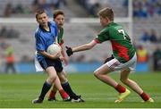 30 August 2015; Darragh Farrell, Edenderry BNS, Edenderry, Offaly, representing Dublin, in action against Cian Ryle, Clonaghadoo NS, Geashill, Offaly, representing Mayo, and Dylan Thornton, St. Oliver Plunkett NS, Ballina, Mayo,, right, during the Cumann na mBunscol INTO Respect Exhibition Go Games 2015 at Dublin v Mayo - GAA Football All-Ireland Senior Championship Semi-Final. Croke Park, Dublin.