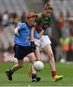 30 August 2015; Tommy Clifford, St Canice's Co-Ed, Granges Road, Kilkenny, representing Dublin, in action against Dylan Thornton, St. Oliver Plunkett NS, Ballina, Mayo during the Cumann na mBunscol INTO Respect Exhibition Go Games 2015 at Dublin v Mayo - GAA Football All-Ireland Senior Championship Semi-Final. Croke Park, Dublin. Picture credit: Ray McManus / SPORTSFILE