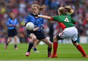 30 August 2015; Breda Cushen, Kiltealy NS, Enniscorthy, Wexford, representing Dublin, in action against Hazel O'Reilly-Higgins, Baconstown, NS, Enfield, Meath, representing Mayo, during the Cumann na mBunscol INTO Respect Exhibition Go Games 2015 at Dublin v Mayo - GAA Football All-Ireland Senior Championship Semi-Final. Croke Park, Dublin. Picture credit: Ray McManus / SPORTSFILE