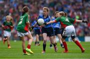 30 August 2015; Breda Cushen, Kiltealy NS, Enniscorthy, Wexford, representing Dublin, in action against Emily Conlon, St. Clare’s PS, Manorhamilton, Leitrim, representing Mayo, left, and Hazel O'Reilly-Higgins, Baconstown, NS, Enfield, Meath, representing Mayo, during the Cumann na mBunscol INTO Respect Exhibition Go Games 2015 at Dublin v Mayo - GAA Football All-Ireland Senior Championship Semi-Final. Croke Park, Dublin. Picture credit: Ray McManus / SPORTSFILE