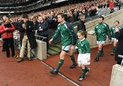 28 February 2009; Ireland captain Brian O'Driscoll, accompanied by mascot Isabel Finlay, leads his side out before the game. RBS Six Nations Rugby Championship, Ireland v England, Croke Park, Dublin. Picture credit: Brendan Moran / SPORTSFILE