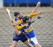 1 March 2009; Paul Curran, Tipperary, manages to keep possession under pressure from Alan Markham, Clare. Allianz GAA National Hurling League, Division 1, Round 3, Tipperary v Clare, Semple Stadium, Thurles, Co. Tipperary. Picture credit: Brendan Moran / SPORTSFILE