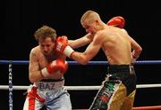 6 March 2009; Karl Place, right, in action against Baz Carey, during their Light Welterweight bout. Frank Maloney Promotions, Karl Place v Baz Carey, Robin Park Centre, Wigan, England. Picture credit: Brian Lawless / SPORTSFILE