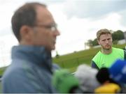 1 September 2015; Eunan O'Kane, Republic of Ireland, watches on as manager Martin O'Neill is interviewed, during a pitchside press conference. Republic of Ireland Press Conference, Abbotstown, Co. Dublin. Picture credit: David Maher / SPORTSFILE