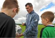 1 September 2015; Roy Keane, Republic of Ireland assistant manager, gives autographs to participants during the FAI Golden Camp, a summer camp run by the FAI for season ticket holders who participated in the Sports World Summer Soccer Schools Programme. Abbotstown, Co. Dublin. Picture credit: Sam Barnes / SPORTSFILE