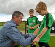 1 September 2015; Roy Keane, Republic of Ireland assistant manager, gives autographs to participants during the FAI Golden Camp, a summer camp run by the FAI for season ticket holders who participated in the Sports World Summer Soccer Schools Programme. Abbotstown, Co. Dublin. Picture credit: Sam Barnes / SPORTSFILE