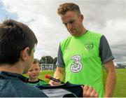 1 September 2015; Alex Pearce, Republic of Ireland, gives autographs to participants during the FAI Golden Camp, a summer camp run by the FAI for season ticket holders who participated in the Sports World Summer Soccer Schools Programme. Abbotstown, Co. Dublin. Picture credit: Sam Barnes / SPORTSFILE