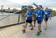 1 September 2015; The Grant Thornton Corporate 5k Team Challenge, Docklands Dublin is now in its fourth year. The flagship race rounds off the successful three-race series of 2015 with the first two races taking place at the National Sports Campus, Fingal and in Cork City. Pictured are members of Team Eversheds making their way across the Sean O'Casey bridge to the start of the race. Docklands, Dublin. Picture credit: Seb Daly / SPORTSFILE