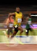 25 August 2015; Usain Bolt of Jamaica on his way to winning his semi-final of the Men's 200m event. IAAF World Athletics Championships Beijing 2015 - Day 4, National Stadium, Beijing, China. Picture credit: Stephen McCarthy / SPORTSFILE