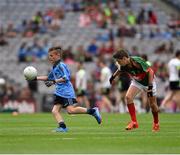 30 August 2015; Adam Gallagher, Moylough NS, Tubbercurry, Sligo, representing Dublin, in action against Adam Reilly, St. Mel’s NS, Ardagh, Longford, representing Mayo, during the Cumann na mBunscol INTO Respect Exhibition Go Games 2015 at Dublin v Mayo - GAA Football All-Ireland Senior Championship Semi-Final. Croke Park, Dublin. Picture credit: Ray McManus / SPORTSFILE