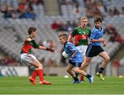 30 August 2015; Adam Gallagher, Moylough NS, Tubbercurry, Sligo, representing Dublin, in action against Adam Reilly, St. Mel’s NS, Ardagh, Longford, representing Mayo, during the Cumann na mBunscol INTO Respect Exhibition Go Games 2015 at Dublin v Mayo - GAA Football All-Ireland Senior Championship Semi-Final. Croke Park, Dublin. Picture credit: Ray McManus / SPORTSFILE