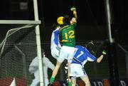 7 March 2009; Brian Meade, no.12, Meath, fists the ball past Laois goalkeeper Michael Nolan and Padraig McMahon, no. 7, to score his side's first goal of the game. Allianz GAA National Football League, Division 2, Round 3, Meath v Laois, Pairc Tailteann, Navan, Co. Meath. Picture credit: Matt Browne / SPORTSFILE