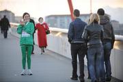 8 March 2009; Ireland's Mary Cullen is congratulated by locals as she poses for a photograph with the bronze medal she won in the Women's 3000m. European Indoor Athletics Championships, Oval Lingotto, Torino, Italy. Picture credit: Brendan Moran / SPORTSFILE