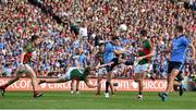 30 August 2015; Bernard Brogan, Dublin, kicks a point despte the best efforts of Colm Boyle, Mayo. GAA Football All-Ireland Senior Championship, Semi-Final, Dublin v Mayo, Croke Park, Dublin. Picture credit: Brendan Moran / SPORTSFILE