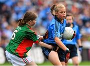 30 August 2015; Dearbhla Tinnelly, St. Mary’s NS, Knockbridge, Dundalk, Louth, representing Dublin, is tackled by Aimee Duffy, Killanny NS, Carrickmacross, Monaghan, representing Mayo, in action during the Cumann na mBunscol INTO Respect Exhibition Go Games 2015 at Dublin v Mayo - GAA Football All-Ireland Senior Championship Semi-Final. Croke Park, Dublin. Picture credit: Ramsey Cardy / SPORTSFILE