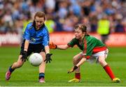 30 August 2015; Ava Kennedy, St. John of God GNS, Artane, Dublin, in action against Aimee Duffy, Killanny NS, carrickmacross, Monaghan, representing Mayo, in action during the Cumann na mBunscol INTO Respect Exhibition Go Games 2015 at Dublin v Mayo - GAA Football All-Ireland Senior Championship Semi-Final. Croke Park, Dublin. Picture credit: Ramsey Cardy / SPORTSFILE