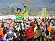 13 March 2009; Jockey Ruby Walsh celebrates with trainer Paul Nicholls, bottom right, after winning the totesport Cheltenham Gold Cup Steeple Chase onboard Kauto Star. Cheltenham Racing Festival - Friday. Prestbury Park, Cheltenham, Gloucestershire, England. Picture credit: David Maher / SPORTSFILE