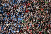 5 September 2015; Dublin and Mayo supporters in the Cusack Stand shield their eyes from the sun. GAA Football All-Ireland Senior Championship Semi-Final Replay, Dublin v Mayo. Croke Park, Dublin. Picture credit: Dáire Brennan / SPORTSFILE