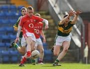 14 March 2009; Shane McCarthy, Cork, shoots to score a point in the first half despite the attempted block from Stephen Browne, Kerry. Cadbury Munster GAA Under 21 Football Championship, Cork v Kerry, Pairc Ui Rinn, Cork. Picture credit: Diarmuid Greene / SPORTSFILE