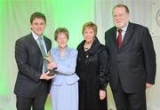 14 March 2009; Paul Burns, Executive Editor, RTE, left, is presented with an award for Broadcaster of the year by Lilly Dunne, wife of the late Mick Dunne, Liz Howard, Uachtarán Chumann Camógaíochta na nGael, and Cathal Goan, RTE General Director, during the Cumann Camógaíochta na nGael Media Awards 2009. Croke Park, Dublin. Picture credit: Ray Lohan / SPORTSFILE