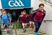 6 September 2015; Galway and Tipperary players along with Galway manager Jeffrey Lynskey, right, make their way out onto the pitch. Electric Ireland GAA Hurling All-Ireland Minor Championship Final, Galway v Tipperary, Croke Park, Dublin. Picture credit: Diarmuid Greene / SPORTSFILE