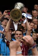 6 September 2015; Galway captain Sean Loftus  lifts the Irish Press cup after the game. Electric Ireland GAA Hurling All-Ireland Minor Championship Final, Galway v Tipperary, Croke Park, Dublin. Picture credit: David Maher / SPORTSFILE