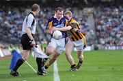17 March 2009; Pat Byrne, Kilmacud Crokes, is tackled by Francie Bellew, Crossmaglen Rangers, under the watchful eyes of linesman Michael Duffy. AIB All-Ireland Senior Club Football Championship Final, Crossmaglen Rangers, Co. Armagh, v Kilmacud Crokes, Dublin. Croke Park, Dublin. Picture credit: Ray McManus / SPORTSFILE