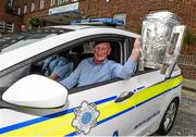 7 September 2015; Kilkenny manager Brian Cody holding the Liam MacCarthy Cup leaves Our Lady's Children's Hospital, Crumlin, in a Garda car following a visit by him and members of the victorious GAA Hurling All-Ireland Champions Kilkenny. Our Lady's Children's Hospital, Crumlin, Dublin. Picture credit: Stephen McCarthy / SPORTSFILE