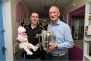7 September 2015; Kilkenny manager Brian Cody and Lester Ryan with 4 month old Meabh Shanahan, from Lixnaw, Co. Kerry, and the Liam MacCarthy Cup during a visit from the GAA Hurling All-Ireland Champions Kilkenny to Our Lady's Children's Hospital, Crumlin, Dublin. Picture credit: Stephen McCarthy / SPORTSFILE