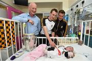 7 September 2015; Kilkenny manager Brian Cody, captain Joey Holden and Kieran Joyce with 1 week old Grace Mayo, from Castlecomer, Co. Kilkenny, and the Liam MacCarthy Cup during a visit from the GAA Hurling All-Ireland Champions Kilkenny to Our Lady's Children's Hospital, Crumlin, Dublin. Picture credit: Stephen McCarthy / SPORTSFILE