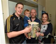 7 September 2015; Kilkenny's Lester Ryan with Kieran and Dolores McLaughlin, from Tullamore, Co. Offaly, and their 14 month old son Killian, and the Liam MacCarthy Cup, during a visit from the GAA Hurling All-Ireland Champions Kilkenny to Our Lady's Children's Hospital, Crumlin, Dublin. Picture credit: Stephen McCarthy / SPORTSFILE