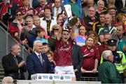 6 September 2015; Galway captain Sean Loftus, in the company of  Uachtarán Chumann Lúthchleas Aogán Ó Fearghail and Kieran O'Reilly, Archbishop of Cashel and Emly, lifts the Irish Press Cup after victory over Tipperary. Electric Ireland GAA Hurling All-Ireland Minor Championship Final, Galway v Tipperary, Croke Park, Dublin. Picture credit: Diarmuid Greene / SPORTSFILE