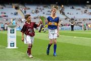 6 September 2015; Eanna Monaghan, left, age 10, from Turloughmore, Co. Galway, and Cian Connolly, age 10, from Nenagh, Co. Tipperary, carry the Irish Press cup off the pitch before the game. Electric Ireland GAA Hurling All-Ireland Minor Championship Final, Galway v Tipperary, Croke Park, Dublin. Picture credit: Diarmuid Greene / SPORTSFILE