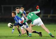 21 March 2009; Kevin Meaney, Laois, in action against James Sherry and Ryan Carson, 14, Fermanagh. Allianz GAA National Football League, Division 2, Round 5, Laois v Fermanagh, O'Moore Park, Portlaoise, Co. Laois. Picture credit: Pat Murphy / SPORTSFILE