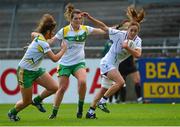 5 September 2015; Aisling Holton, Kildare, in action against Róisín Egan, left, and Michelle Guinan, Offaly. TG4 Ladies Football All-Ireland Intermediate Championship Semi-Final, Kildare v Offaly. Parnell Park, Dublin. Picture credit: Piaras Ó Mídheach / SPORTSFILE