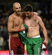 7 September 2015; Shane Long, Republic of Ireland, changes jerseys with Zurab Khizanishvili, Georgia, at the end of the game. UEFA EURO 2016 Championship Qualifier, Group D, Republic of Ireland v Georgia, Aviva Stadium, Lansdowne Road, Dublin. Picture credit: David Maher / SPORTSFILE