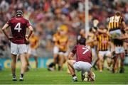 6 September 2015; Dejected Galway players Padraig Mannion, left, and Daithí Burke watch Kilkenny players celebrate after the game. GAA Hurling All-Ireland Senior Championship Final, Kilkenny v Galway, Croke Park, Dublin. Picture credit: Tomás Greally / SPORTSFILE