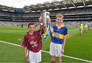6 September 2015; Cup carriers Éanna Monaghan, Bawnmore N.S., Co. Galway, and Cian Connolly, Nenagh C.B.S., Co. Tipperary, carry the Irish Press cup out before the game. Electric Ireland GAA Hurling All-Ireland Minor Championship Final, Galway v Tipperary, Croke Park, Dublin. Picture credit: Ray McManus / SPORTSFILE