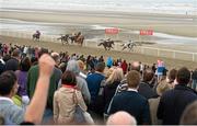 10 September 2015; The crowd looks on as Our Max, with Patrick Mullins up, goes on to win The Hibernia Steel Race. Laytown Races, Laytown, Co. Meath. Picture credit: Cody Glenn / SPORTSFILE