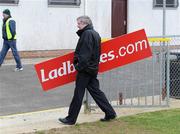 22 March 2009; Derry county board Vice Chairman Anthony McSwiggan with the team signage board before the game. Allianz GAA National Football League, Division 1, Round 5, Derry v Galway, Glen Pitch, Maghera, Co. Derry. Picture credit: Oliver McVeigh / SPORTSFILE *** Local Caption ***