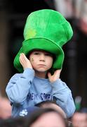 22 March 2009; A young spectator covers his ear from the  music as he awaits to greet the Ireland team on their return to Dublin after completing the Grand Slam. Ireland rugby squad homecoming. Dawson Street, Dublin. Picture credit: Stephen McCarthy / SPORTSFILE