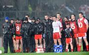 7 March 2009; The Tyrone squad withstand a torrential down pour during the National Anthem. Allianz GAA National Football League, Division 1, Round 3, Tyrone v Galway, Healy Park, Omagh, Co. Tyrone. Picture credit: Oliver McVeigh / SPORTSFILE