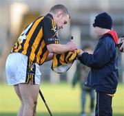 25 January 2009; Richie Hogan, Kilkenny, signs a shirt for a young Antrim supporter after the game. Walsh Cup Semi-Final, Antrim v Kilkenny, Casement Park, Belfast. Picture credit: Oliver McVeigh / SPORTSFILE
