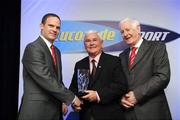 23 March 2009; Ronan McClafferty, Lucozade Sport, left, in the company of Peter Byrne, President of the Association of Sports Journalists in Ireland, makes a presentation to Cork Hurling captain Charlie McCarthy who represented the 1978 team. Cork teams that won three All-Irelands in a row 1976, '77 and '78  were honoured in the latest in the ASJI  Lucozade Sport Sporting Legends series which are organised each year by the Association of Sports Journalists in Ireland, in association with Lucozade Sport. Rochestown Park Hotel, Rochestown, Cork. Picture credit: Ray McManus / SPORTSFILE