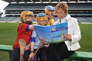 25 March 2009; Uachtaran Chumann Camogaiochta na Gael Liz Howard with Na Fianna Camogie Club players, from left, Ellen Healy, Amy McCarville and Sarah Montgomery at the launch of 'Caman Get A Grip' and 'Caman Get Hooked' Foundation and Level 1 Coaching Education Courses. Croke Park, Dublin. Picture credit: Pat Murphy / SPORTSFILE